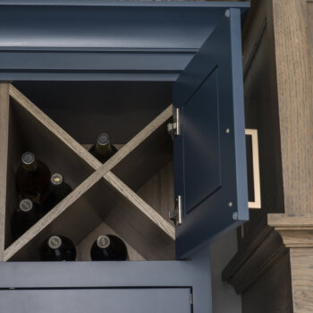 “X” Wall Wine Cube behind cabinet doors from Dura Supreme Cabinetry